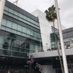 alt="statues of sports players outside stadium"