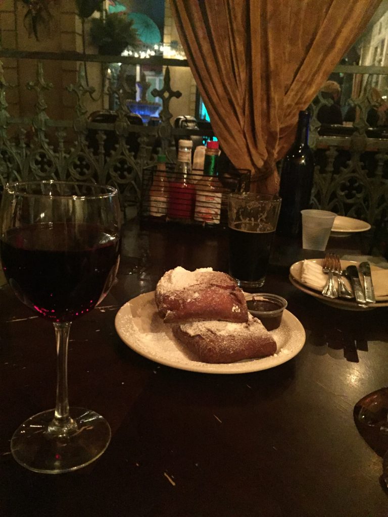 alt="glass red wine & pastries"