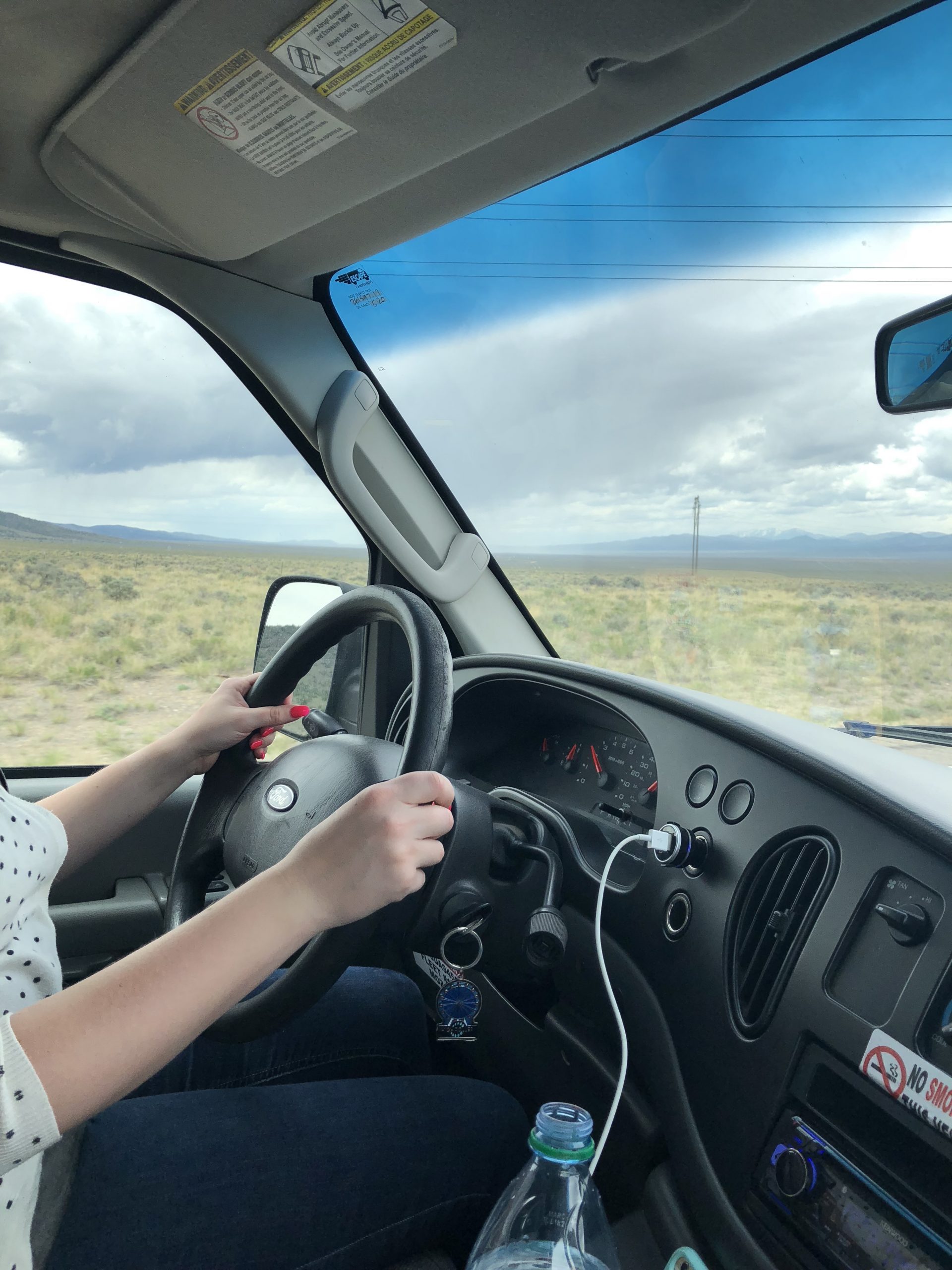 alt="my hands on the van driving wheel"