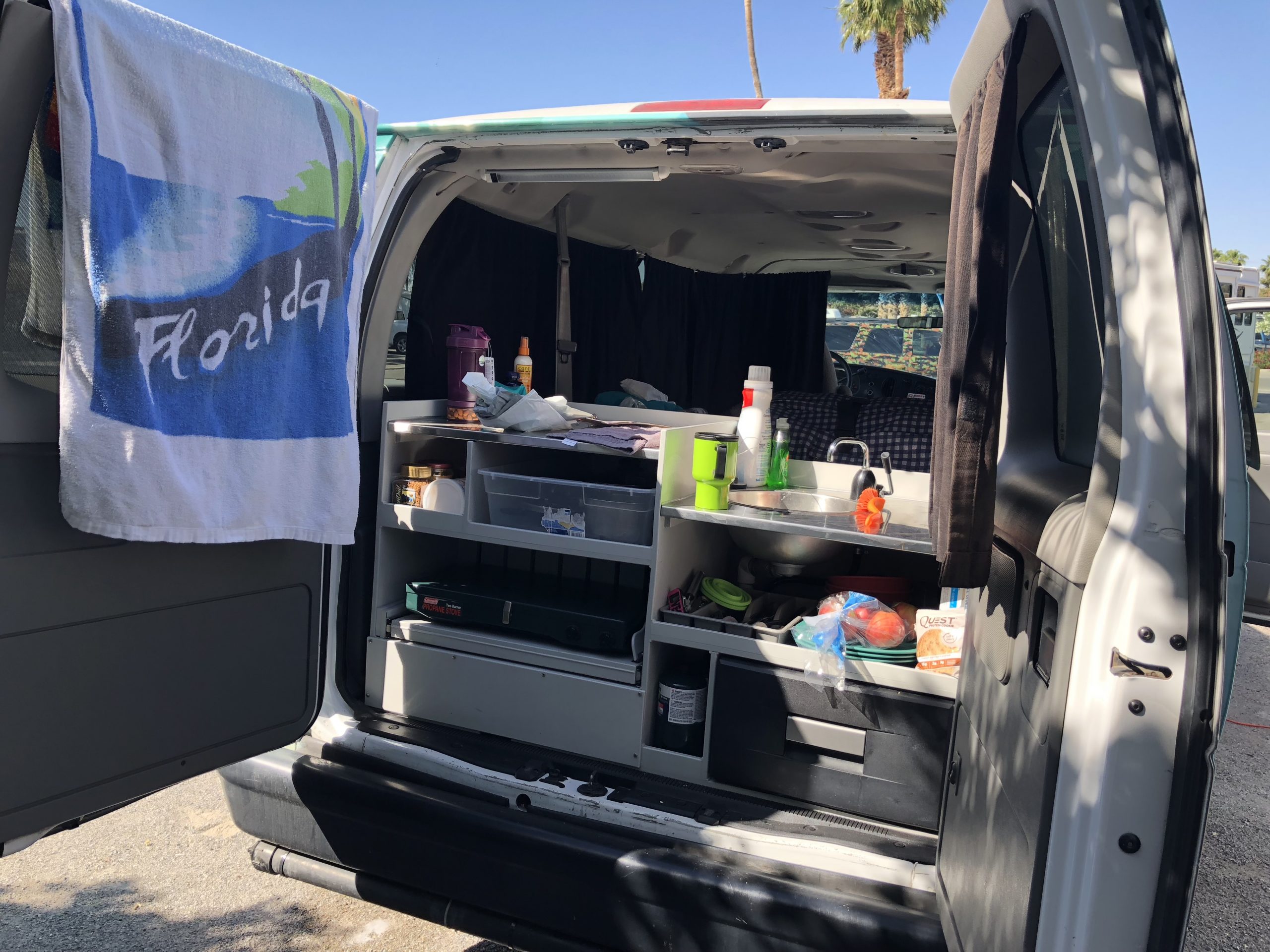alt="the kitchen unit at the rear of the van"