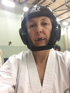 alt="me in my taekwondo sparring kit"