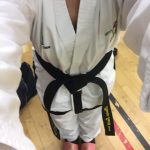 alt="woman in taekwondo sparring kit"