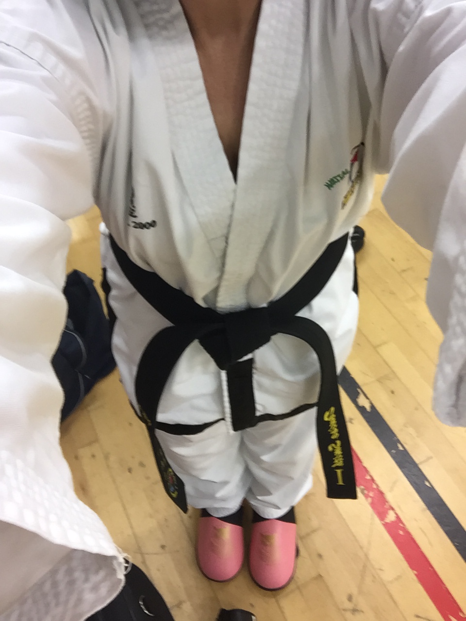 alt="woman in taekwondo sparring kit"