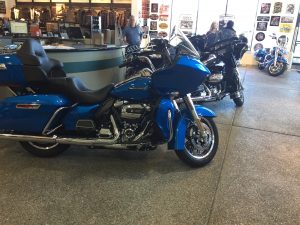 alt="harley motorbikes in a show room"