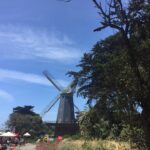 alt="windmill with trees"