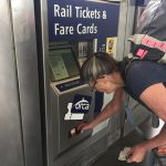 alt="buying tickets from a machine"