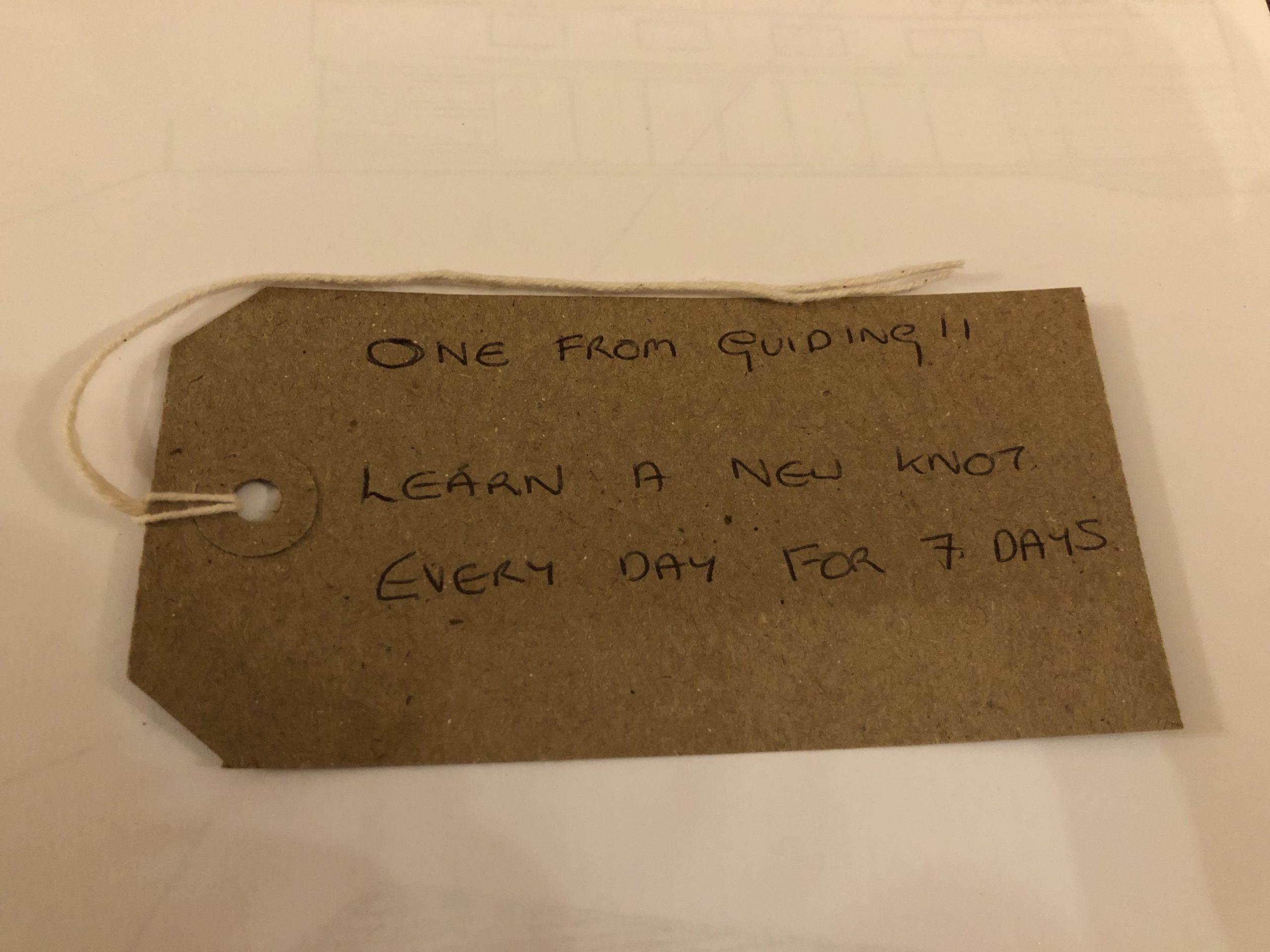 alt="brown label with knot challenge"