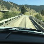 alt="old wooden bridge to get to camp site"