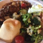 alt="plate of food served at the rodeo"