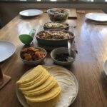 alt="various dishes of food on a table"