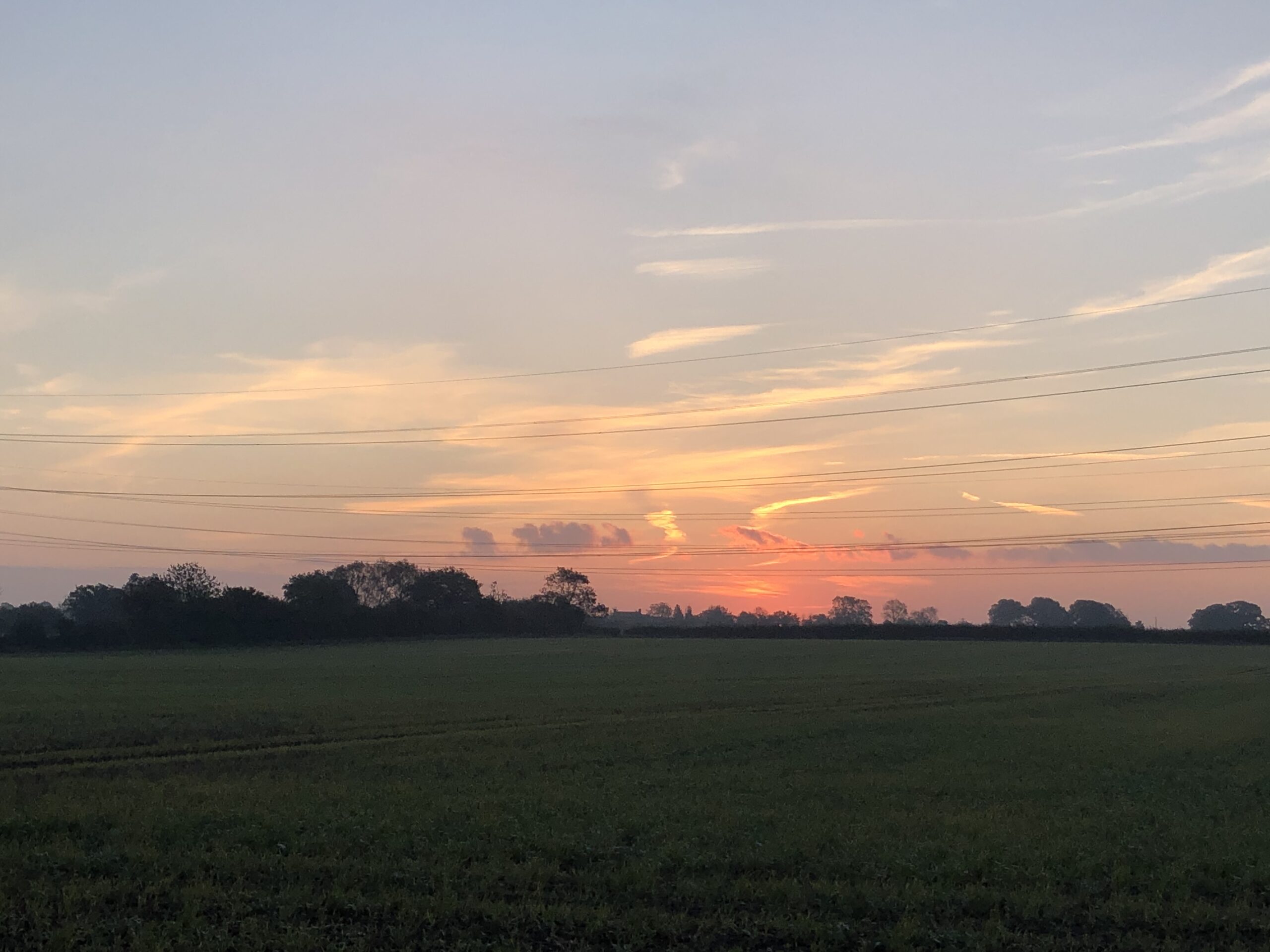 alt="sunrise over fields"