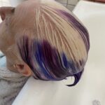 alt="head leaning back over sink"