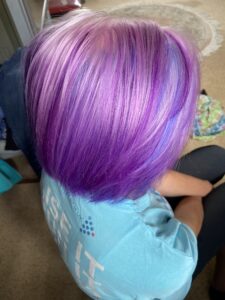 alt="close up of head with coloured hair"