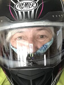 alt="person in a motorbike helmet"