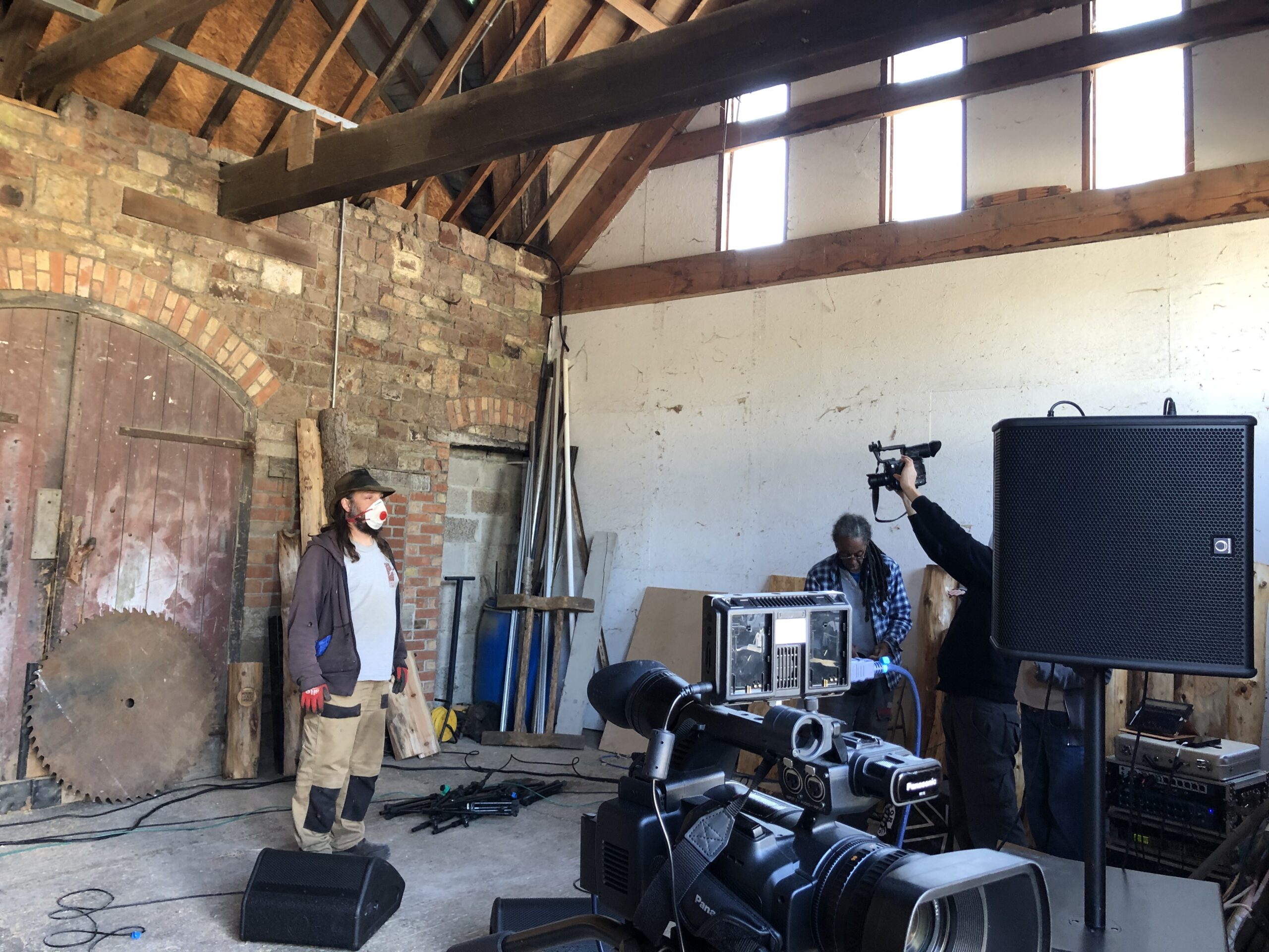 alt="people working with music recording equipment"