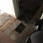 alt="exposed floorboards"