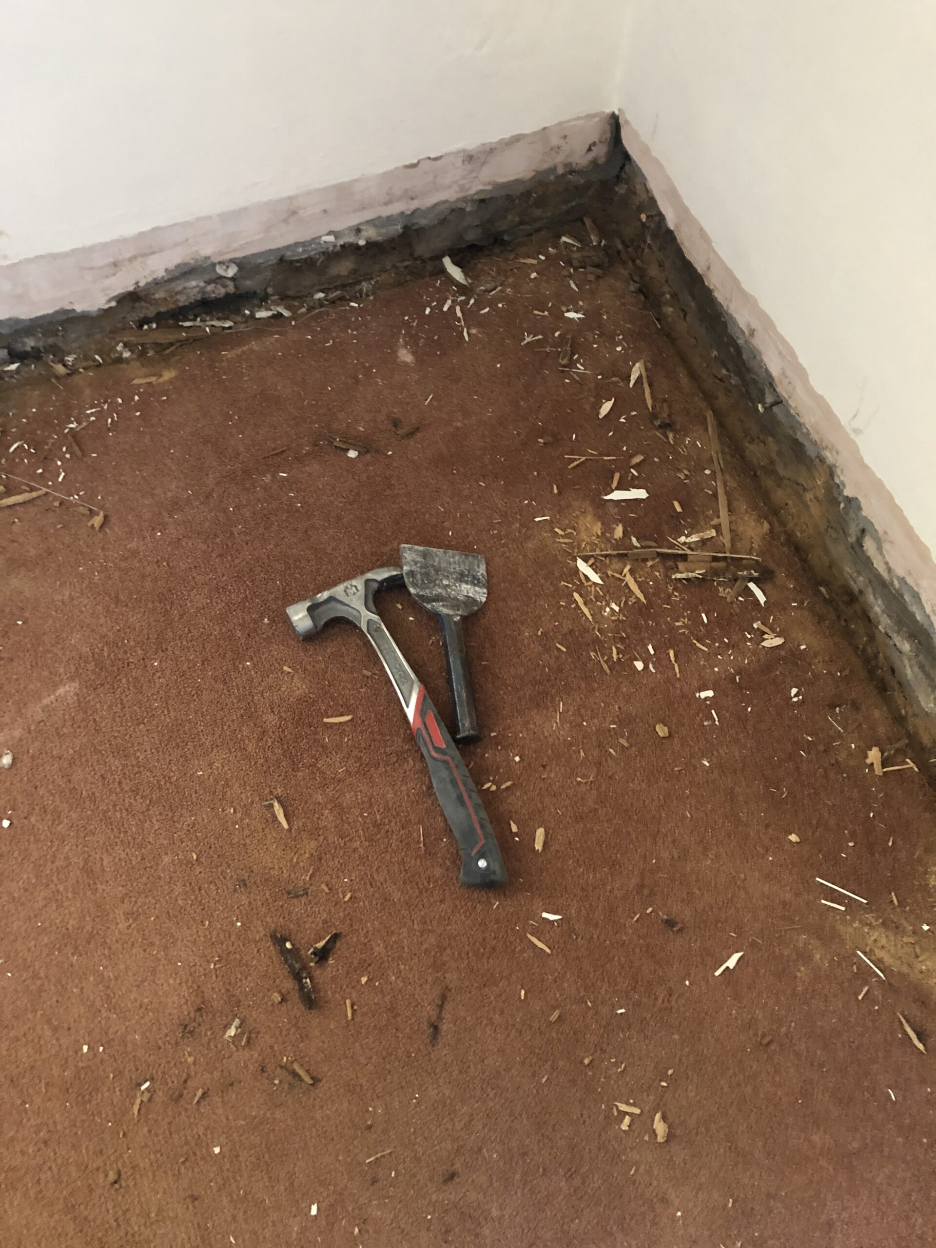 alt="hammer & bolster on floor"