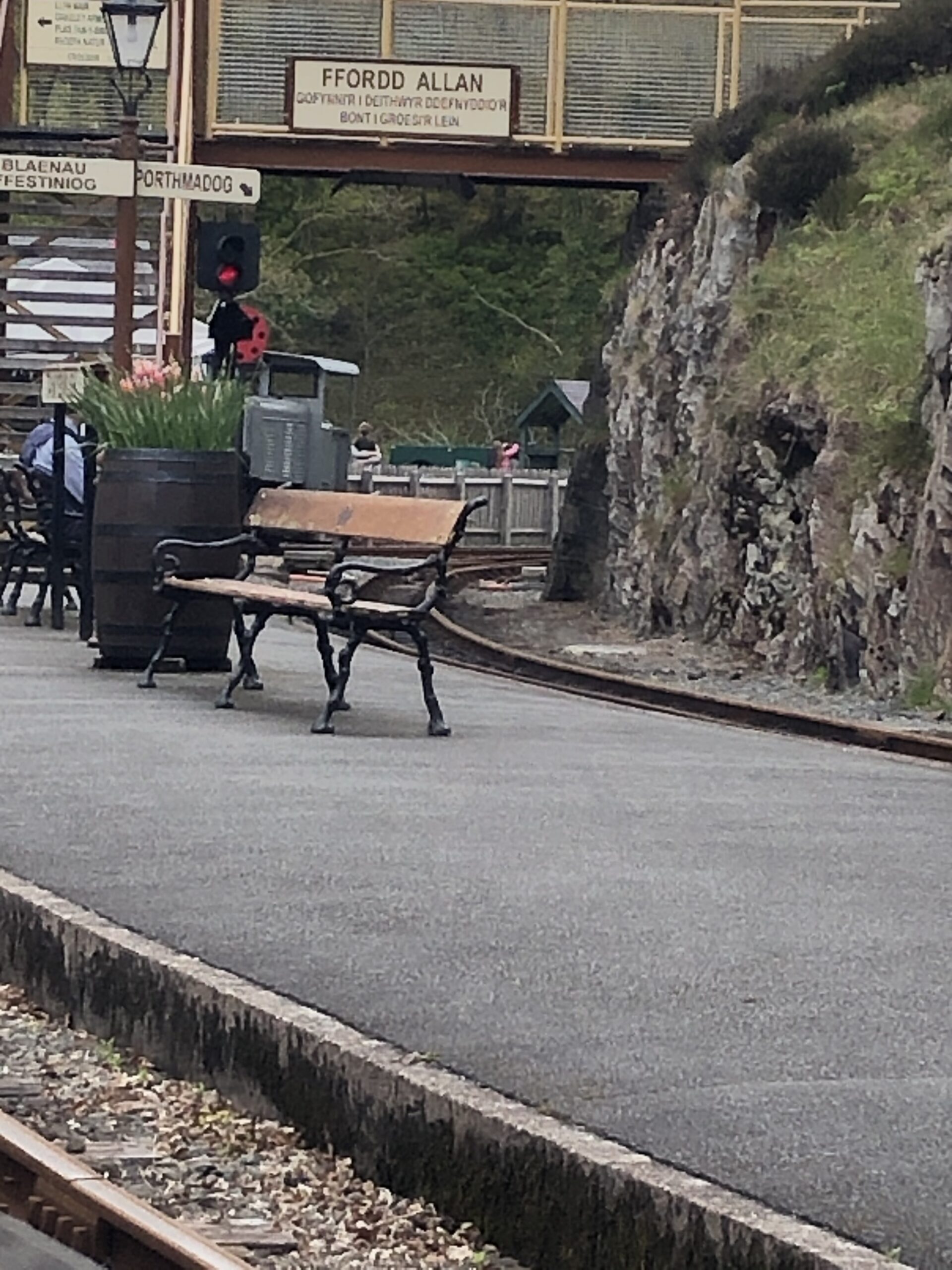 alt="railway station with bench"