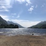 alt="shore of Loch with mountains"