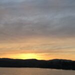 akt="sun set over lake"