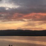 alt="sunset over lake"