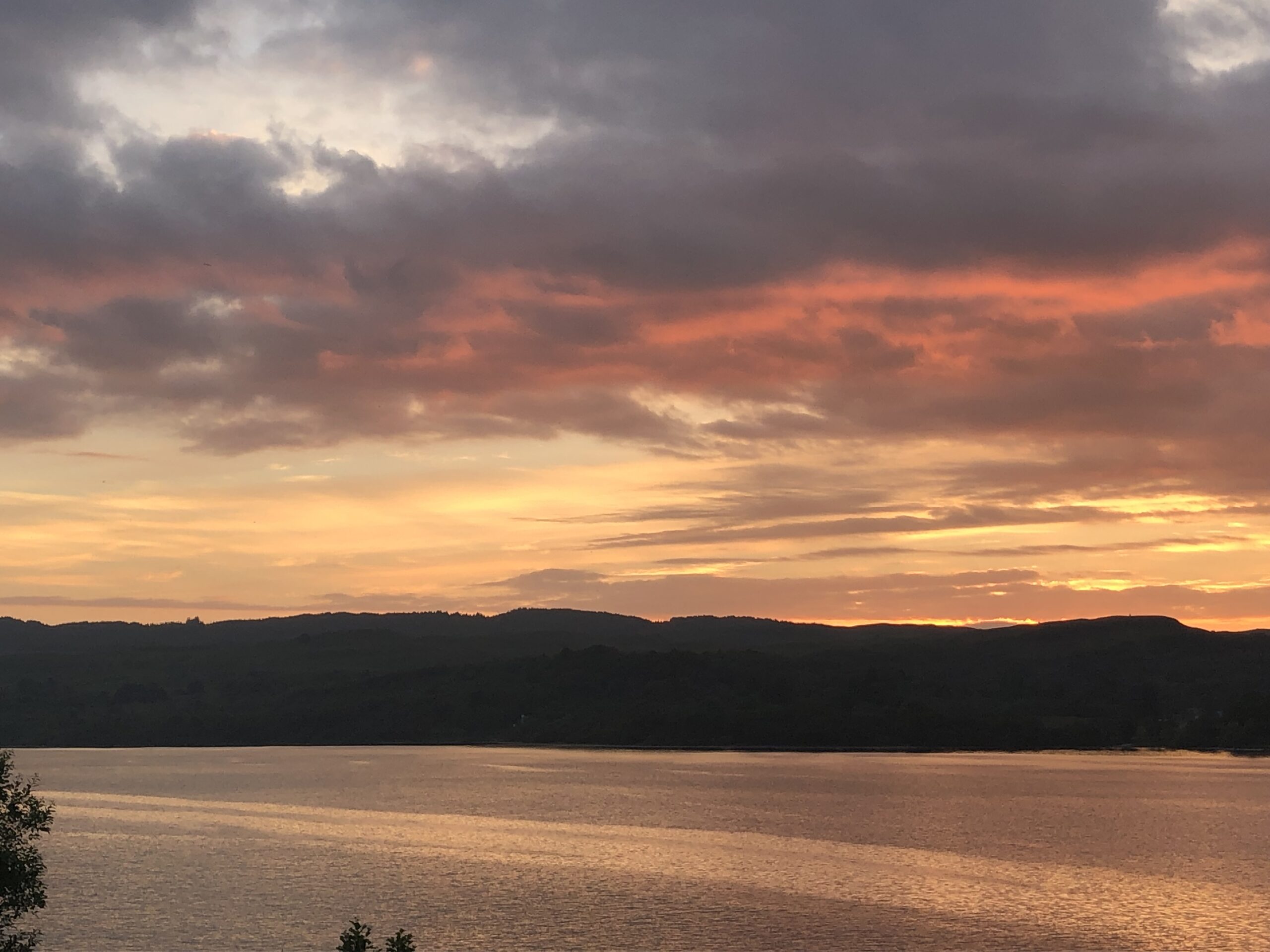 alt="sunset over lake"