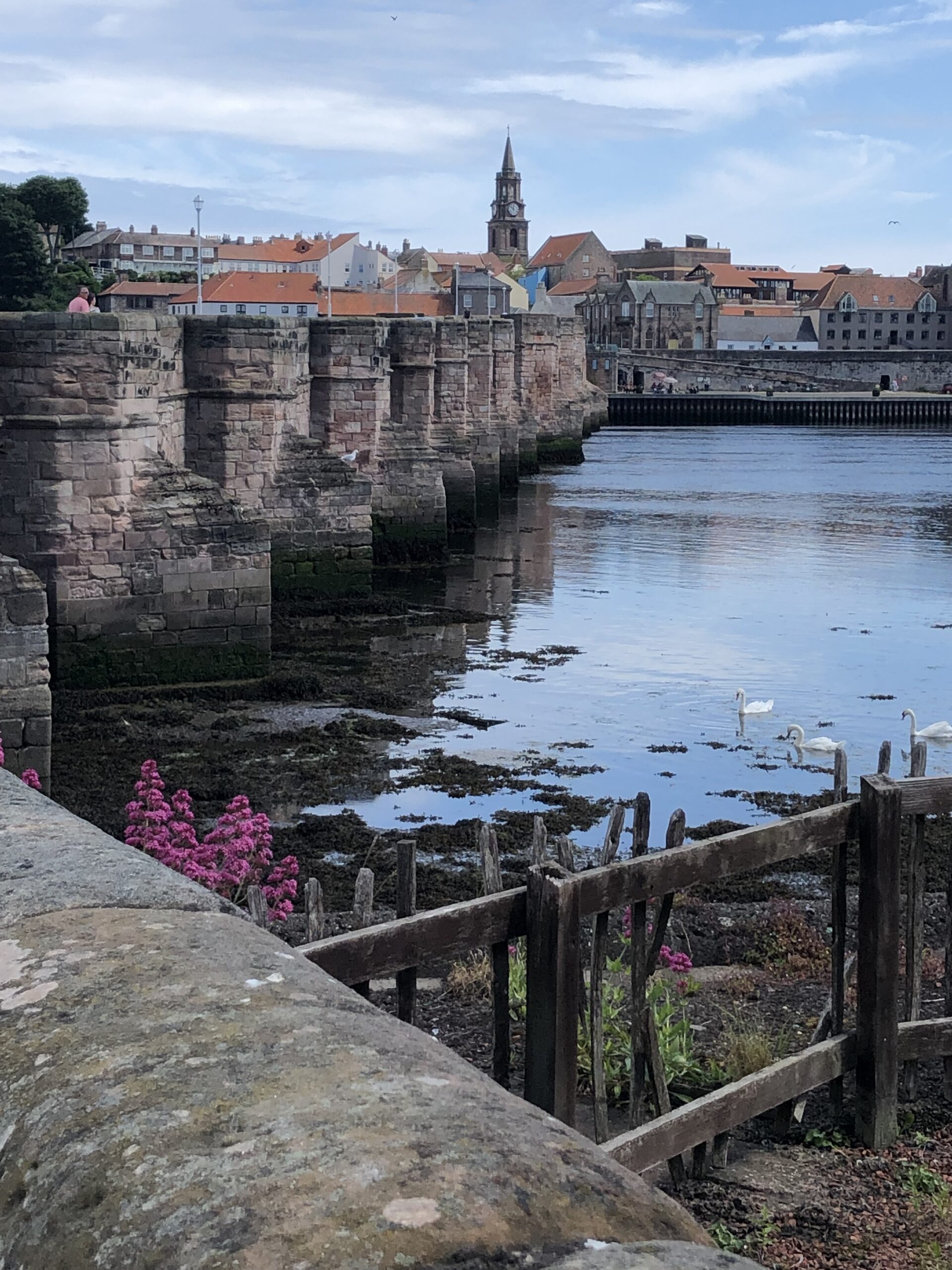 alt="old stone bridge across river"