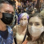 alt="three people with masks on"