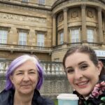 alt="two people with cups of tea"