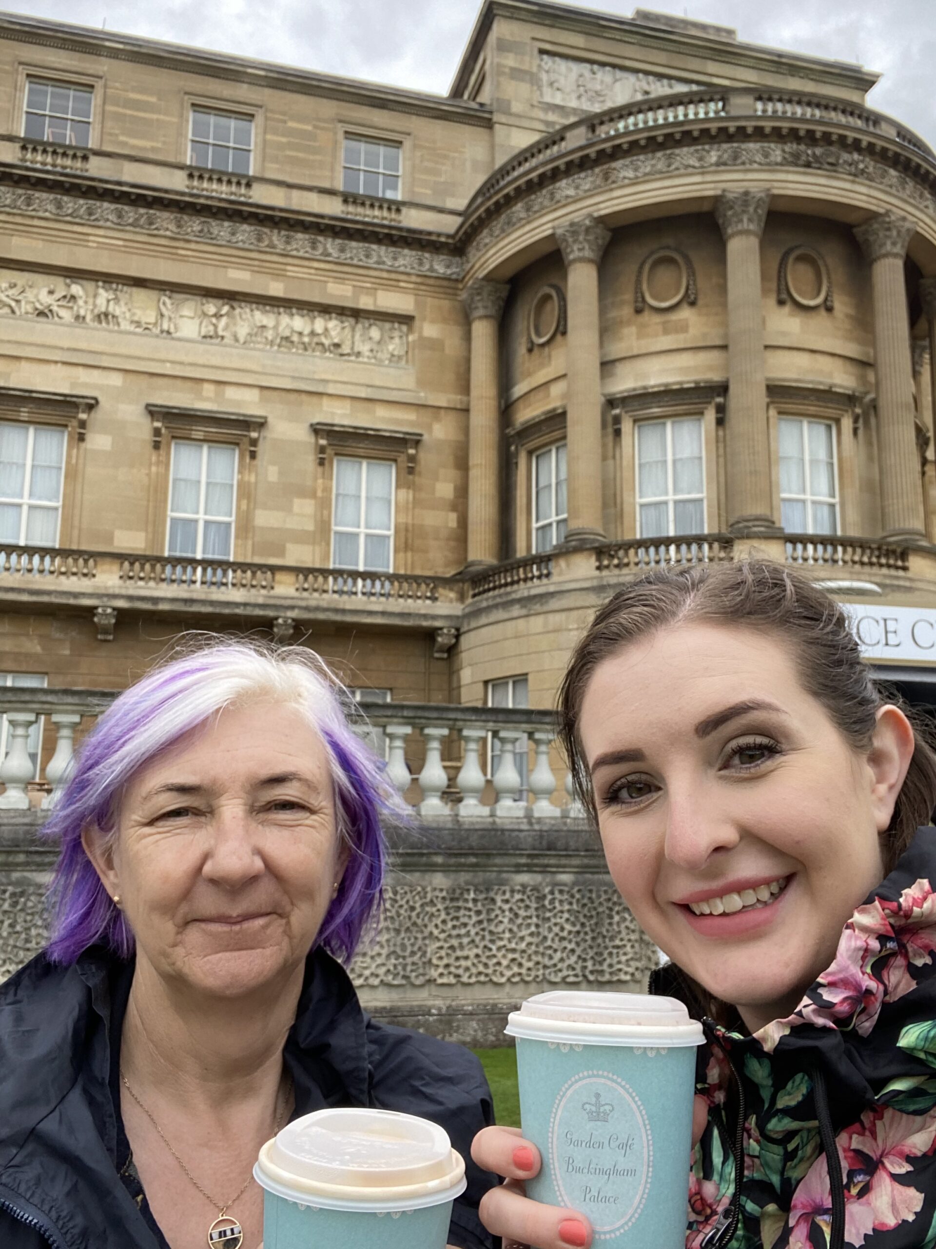 alt="two people with cups of tea"