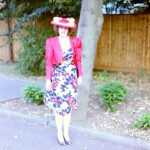 alt="person in dress & hat"