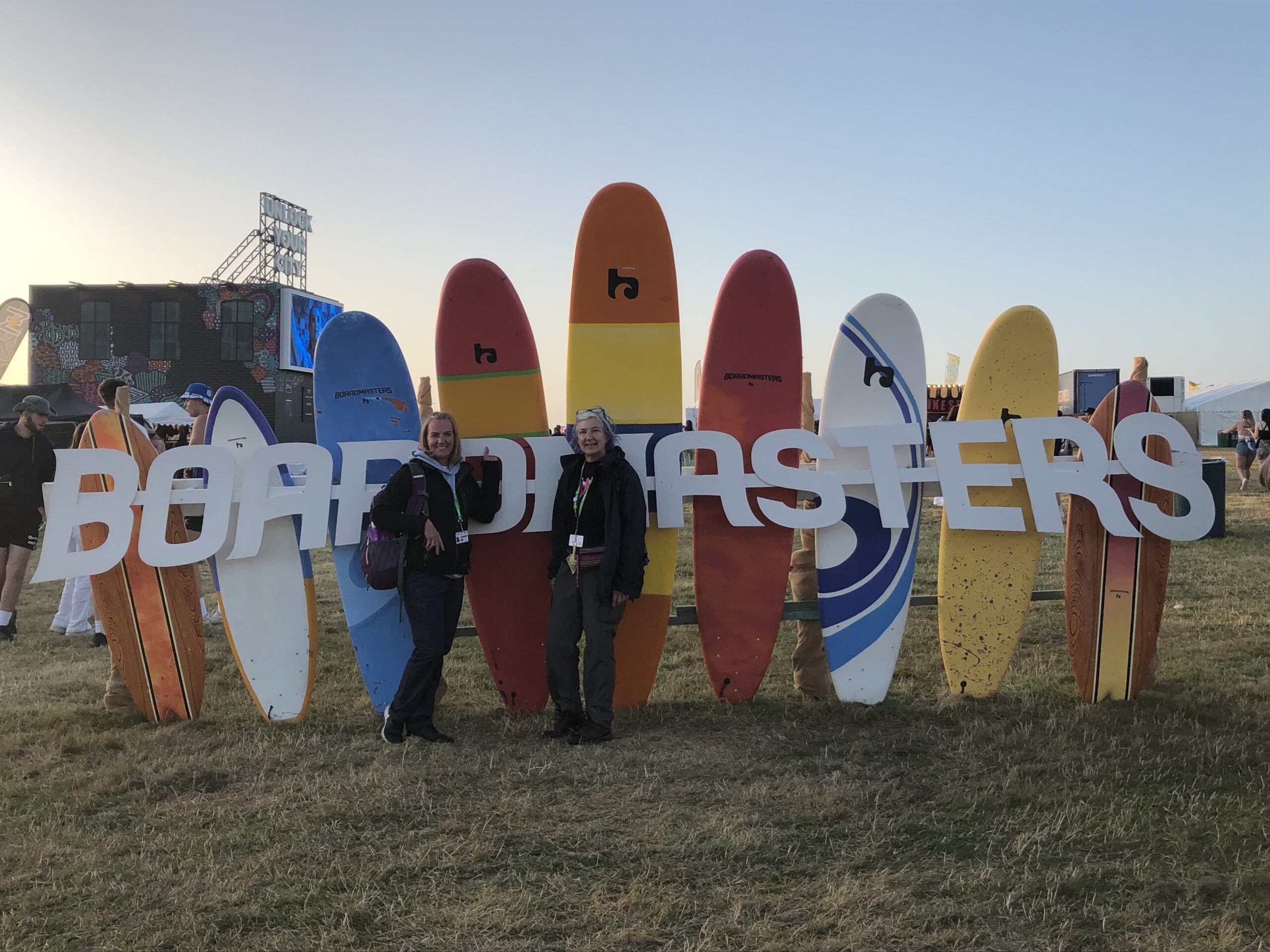 alt="row of coloured surf boards & the letters Boardmasters"