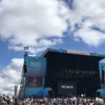 alt="stage with crowd in front"