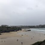 alt="beach with people on it"