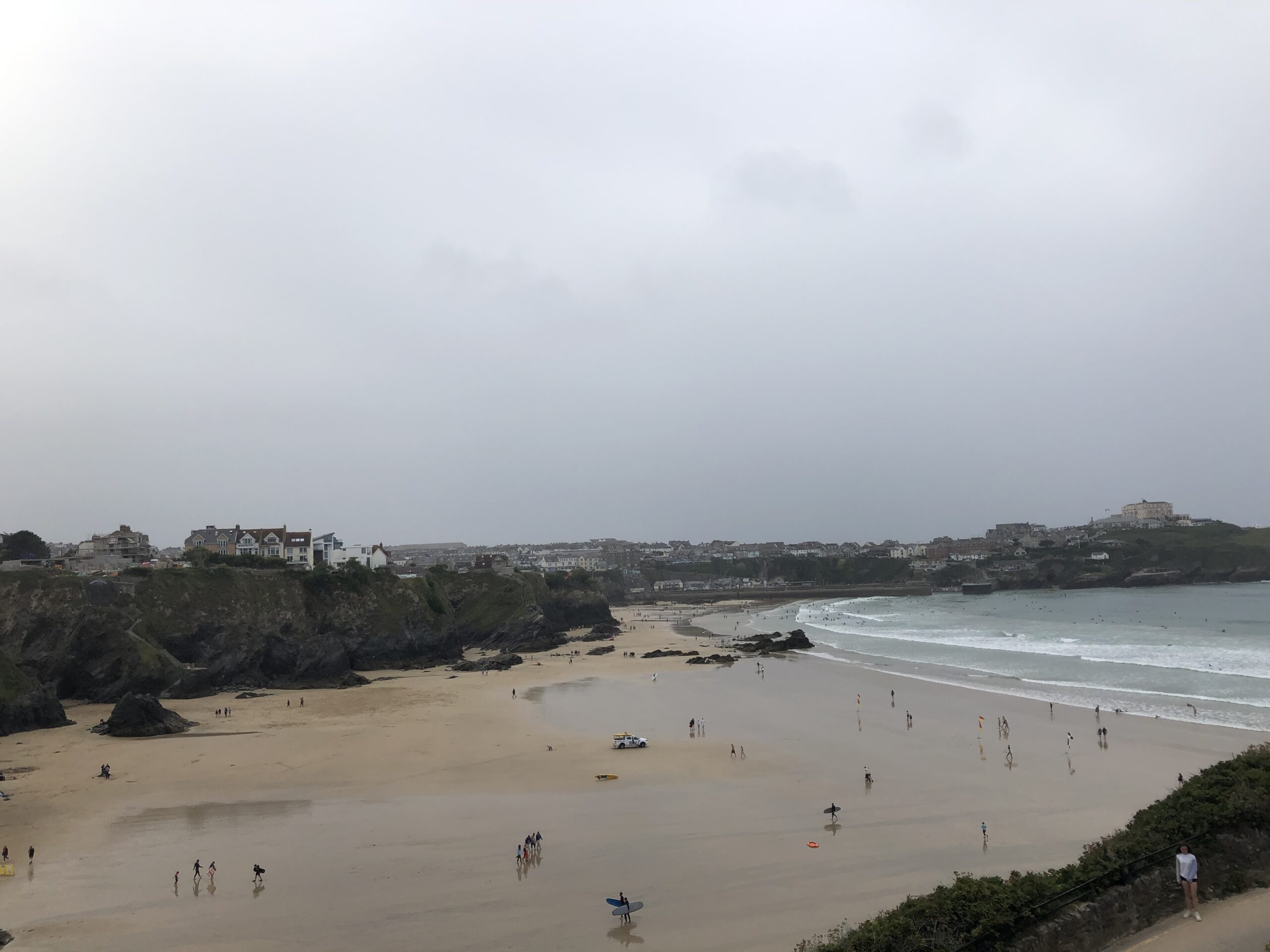 alt="beach with people on it"