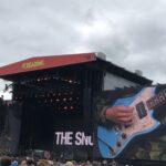 alt="big stage with image of a guitar"