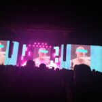 alt="screen on stage with images of iffy clyro"