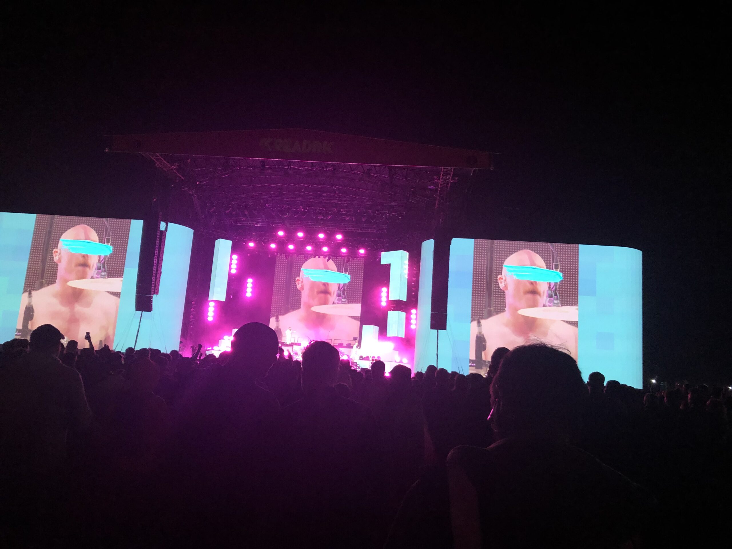 alt="screen on stage with images of iffy clyro"