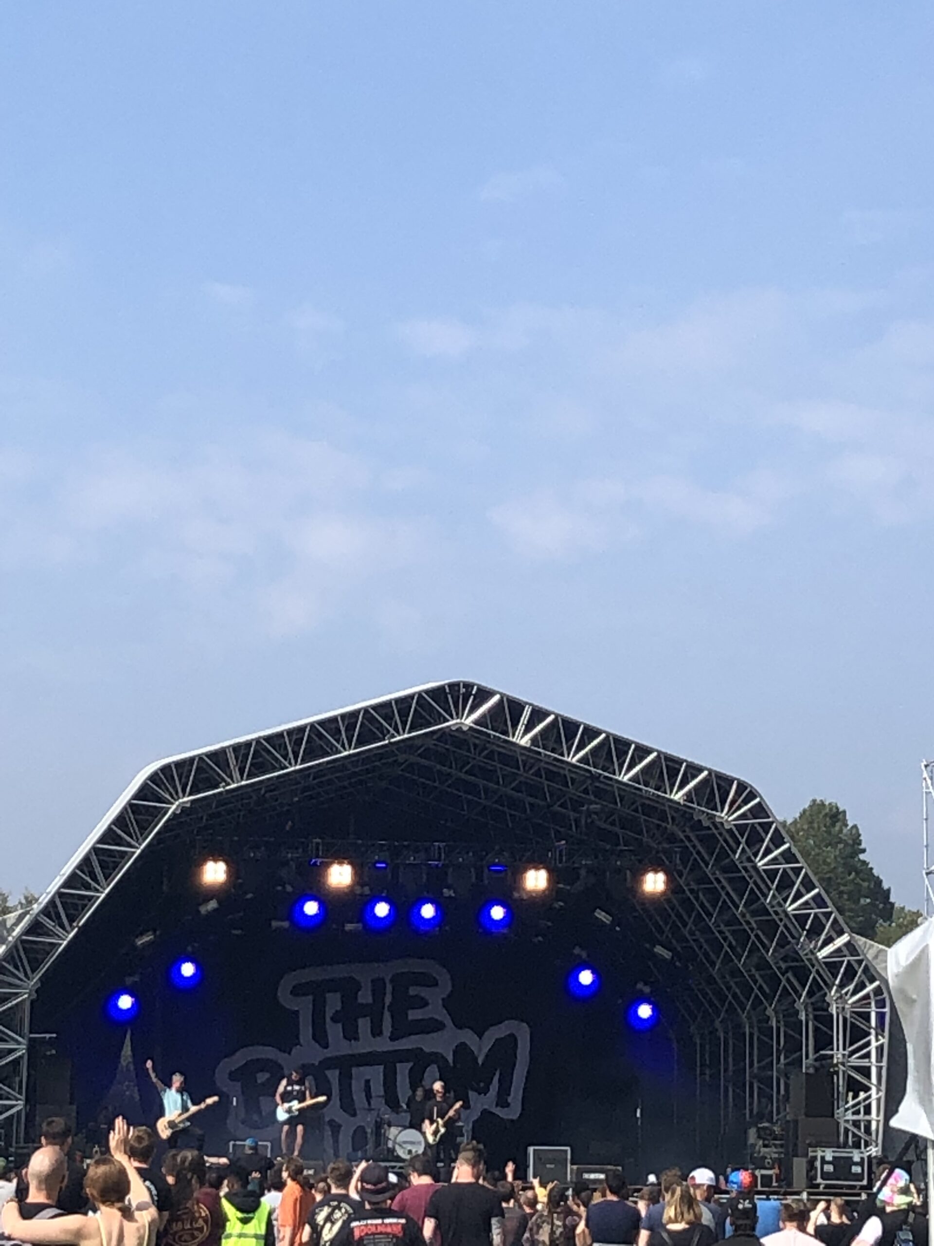 alt="top of main stage awning with crowd"