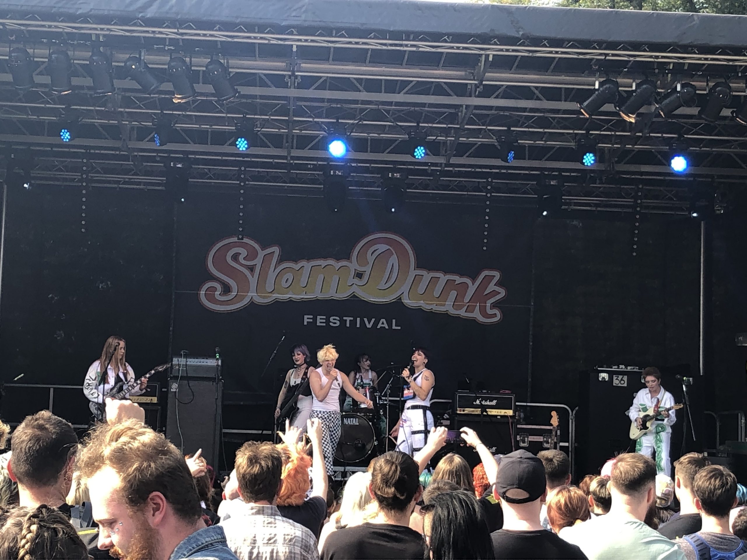 alt="band performing on stage at Slam-dunk Festival"