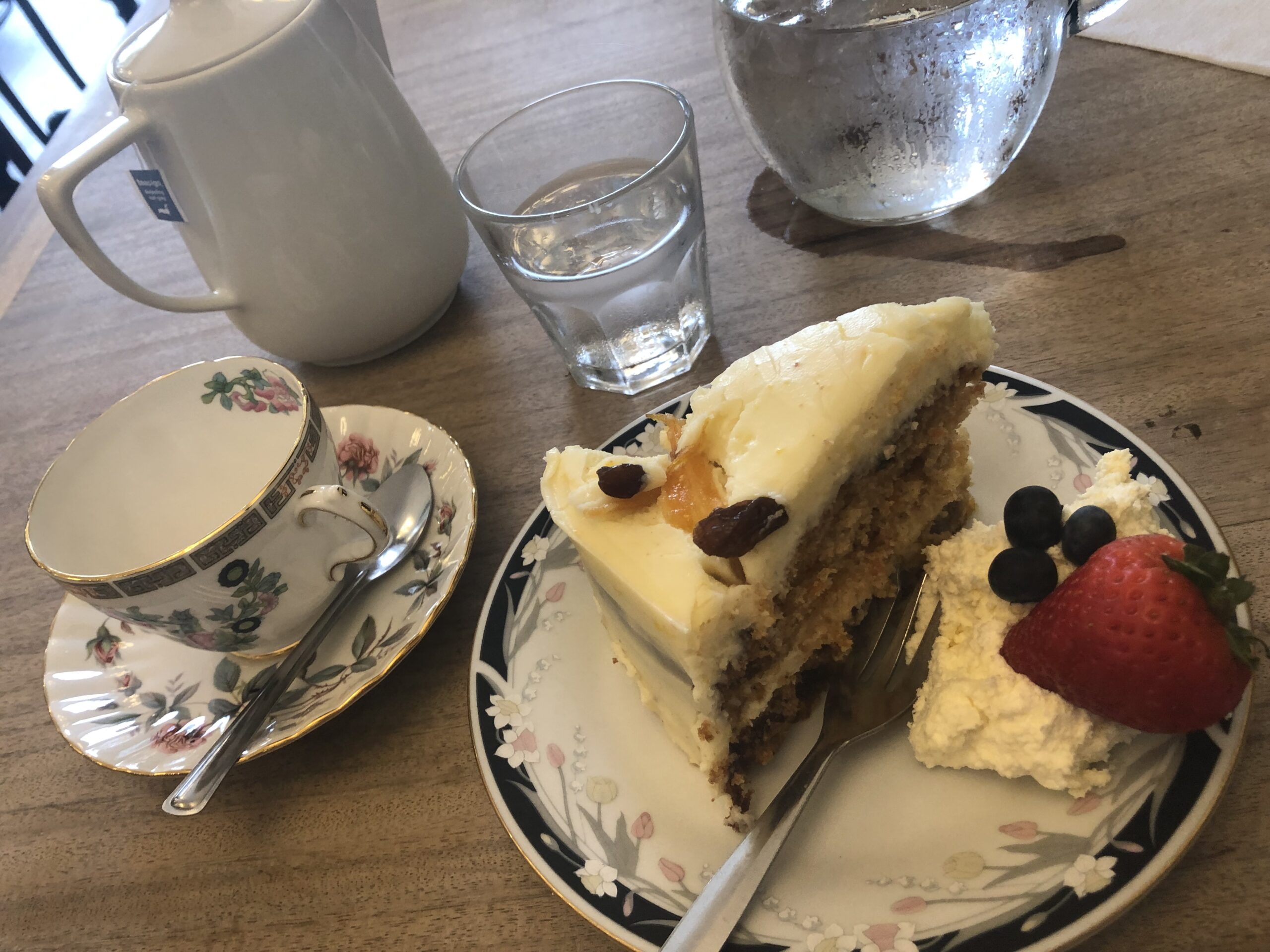 alt="tea cup & plate with sponge cake on"