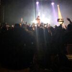 alt="singer crowd surfing"