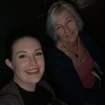 alt="two people sat together"