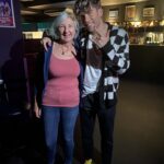 alt="two people standing together "