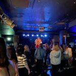 alt="singer on small stage"