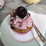 alt="cupcake with cherry on top"