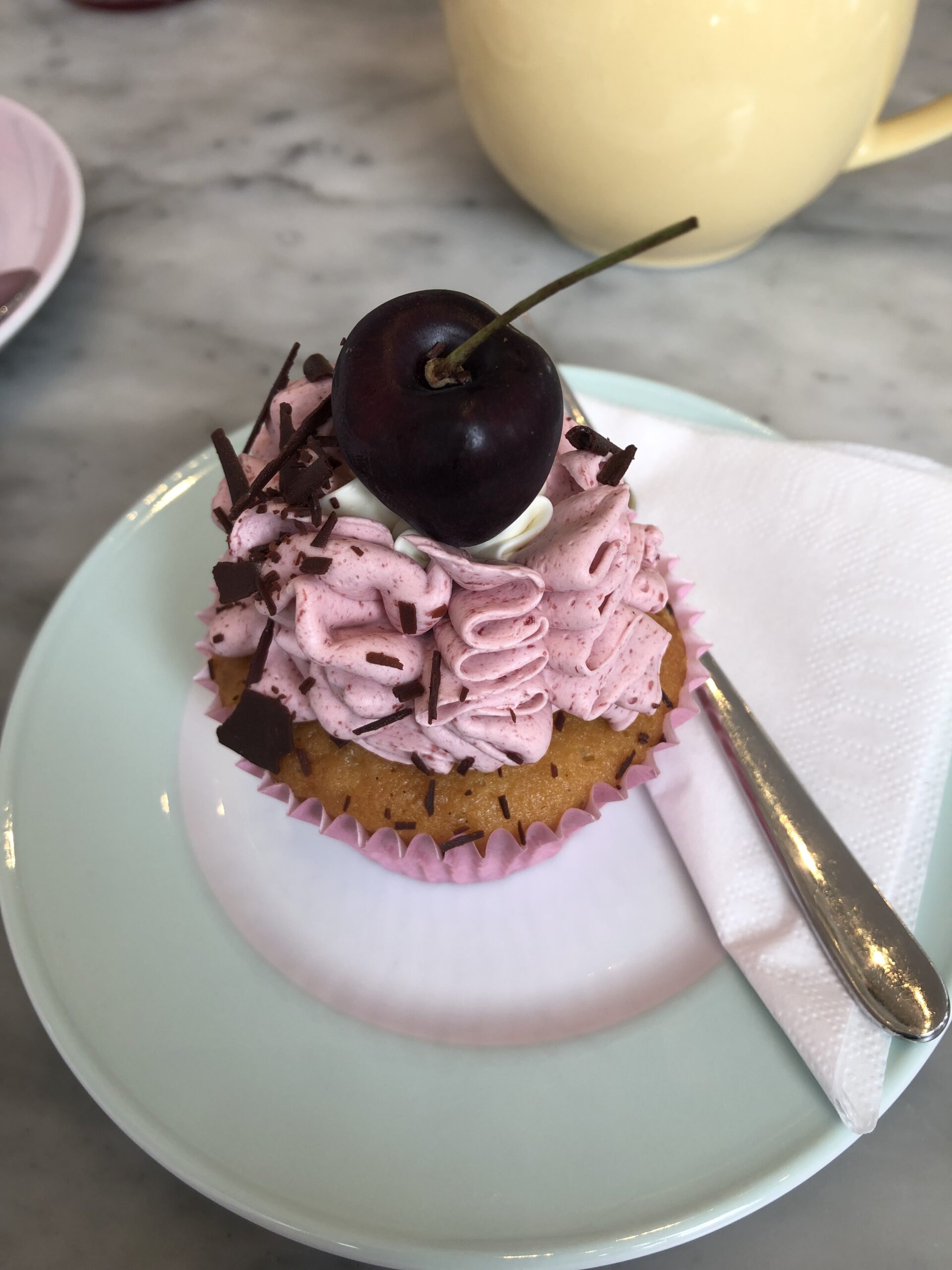 alt="cupcake with cherry on top"