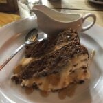 alt="slice of cake & jug of cream"