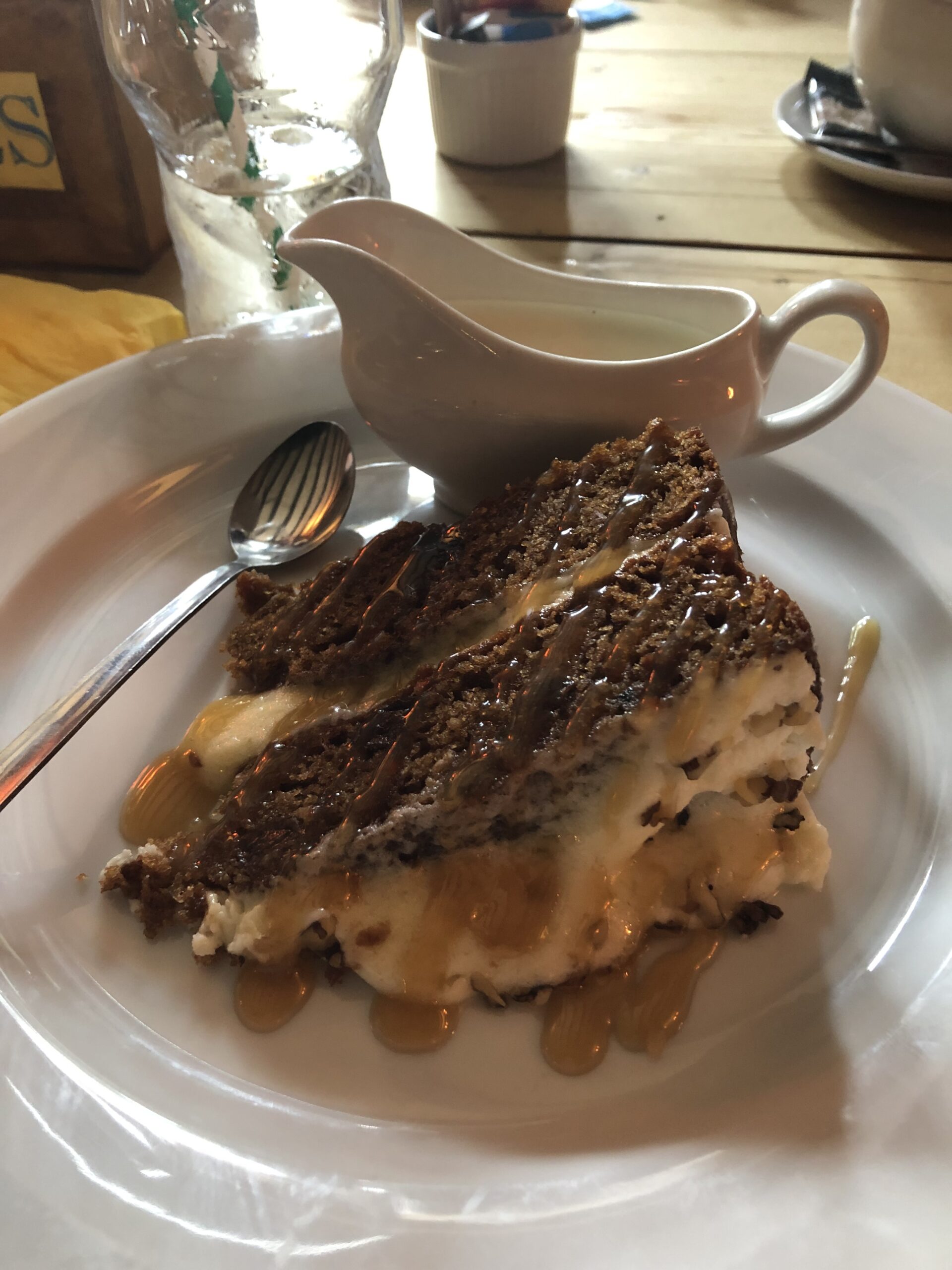 alt="slice of cake & jug of cream"