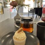 alt="vanilla cupcake & tea"